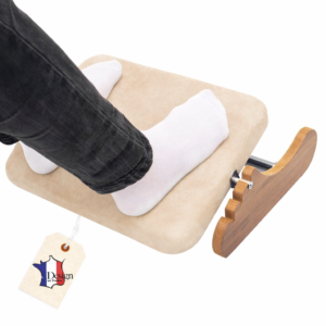 **Alt Text (Short – English):** Beige ergonomic wooden footrest with padded ankle support and adjustable height under desk.